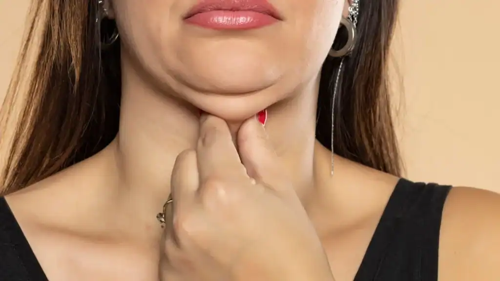 An image of a woman with double chin, sad, worried : Non Surgical Double Chin Removal Treatment in Accrington, UK