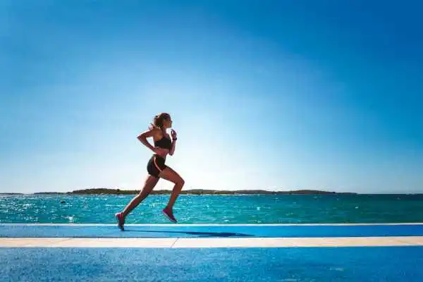 Woman running showing strong leg muscle Accrington
